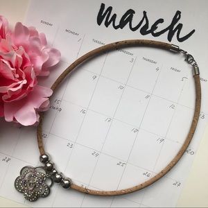 Cork necklace with rhinestone flower.